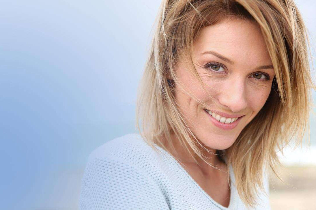 Smiling woman enjoying the everyday mental clarity that comes with good nutrition